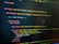 HTML code displayed on a computer screen, featuring elements such as 'mj-body', 'mj-wrapper', and 'mj-text'. The code includes CSS classes for styling purposes, indicating colors with hex codes like '#151629'. A comment suggests this section is the 'Hero Section'.