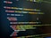 HTML code displayed on a computer screen, featuring elements such as 'mj-body', 'mj-wrapper', and 'mj-text'. The code includes CSS classes for styling purposes, indicating colors with hex codes like '#151629'. A comment suggests this section is the 'Hero Section'.