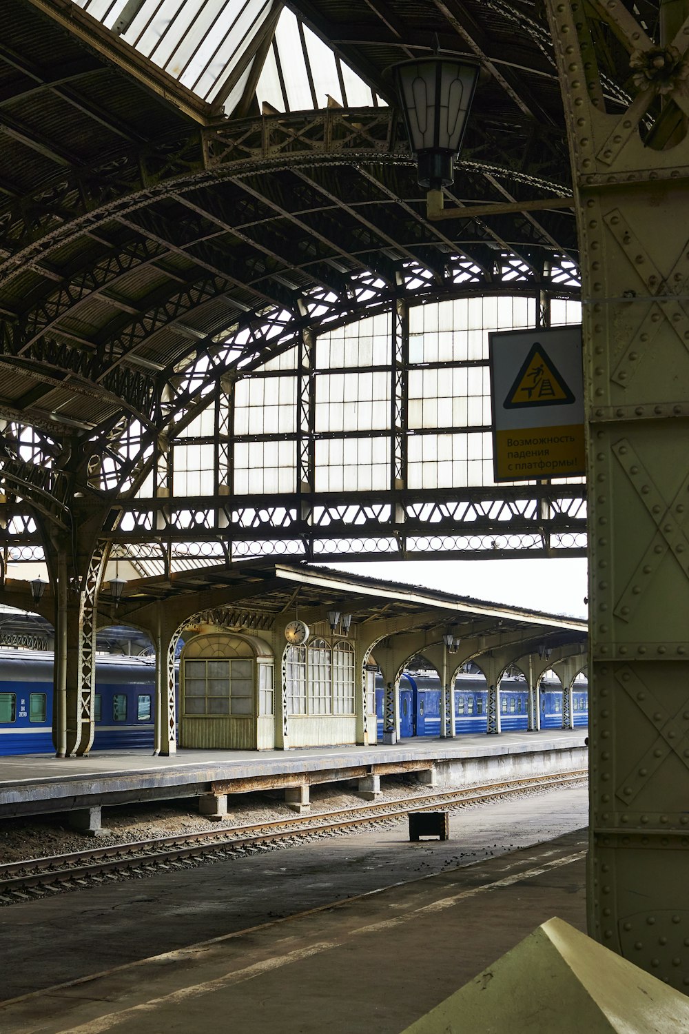 a train pulling into a train station next to a platform