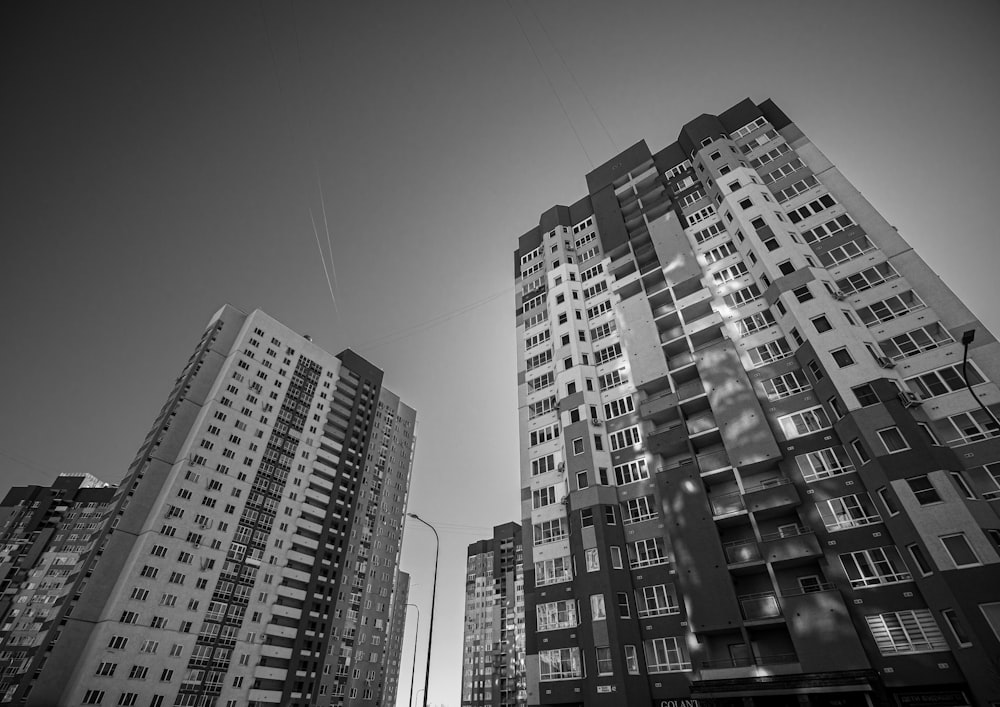 a black and white photo of tall buildings