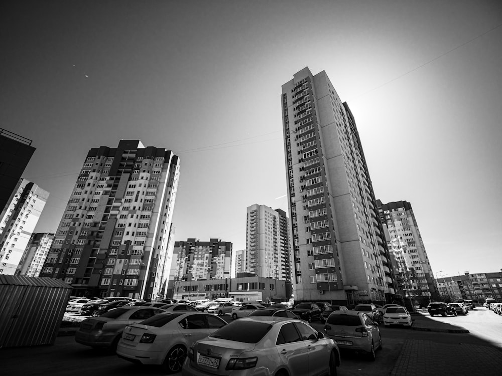 a black and white photo of cars parked in a parking lot