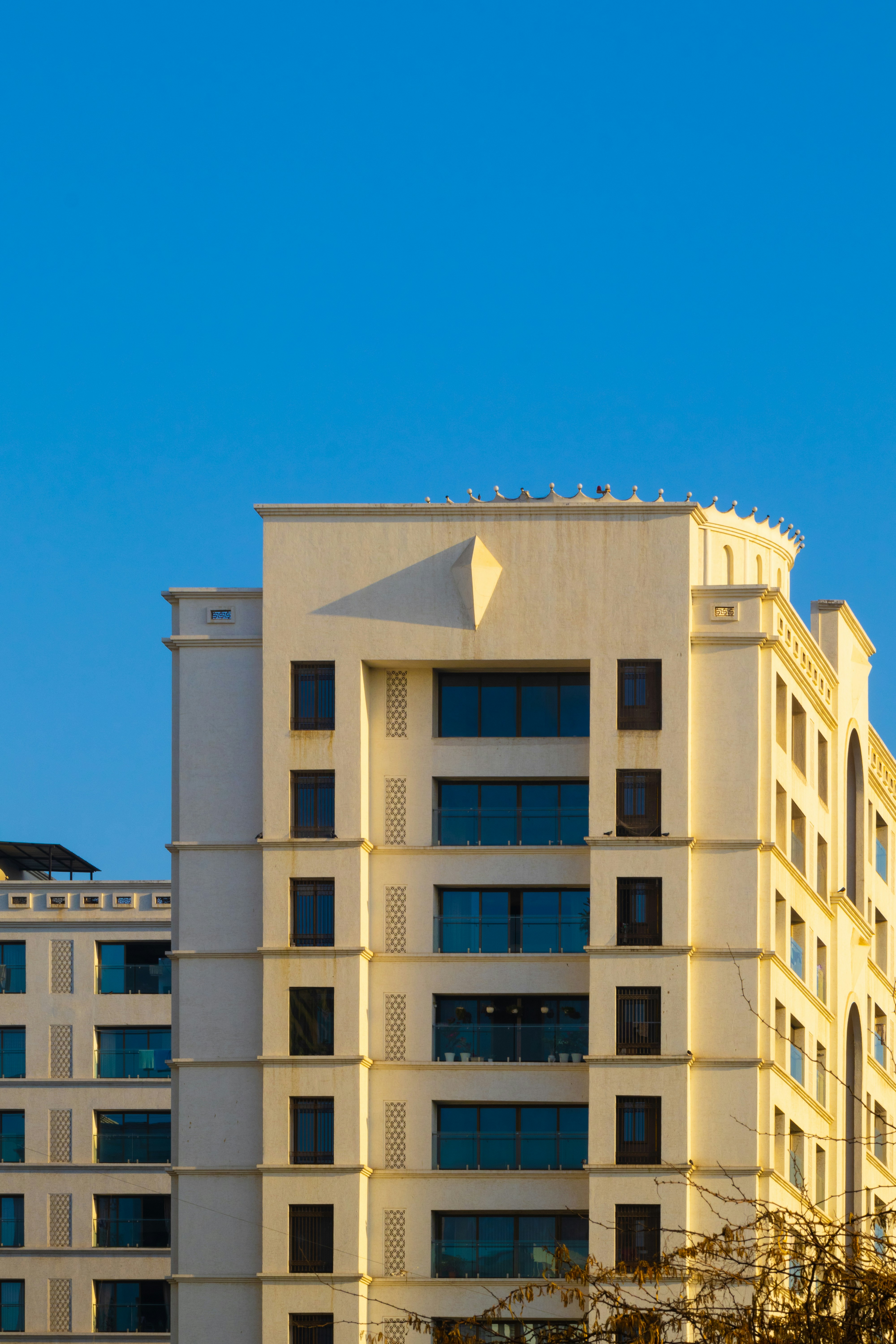 a tall building with a clock on the top of it