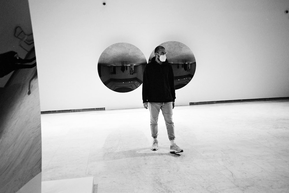 a man standing in front of a sculpture