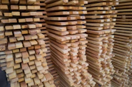 a stack of wooden planks stacked on top of each other