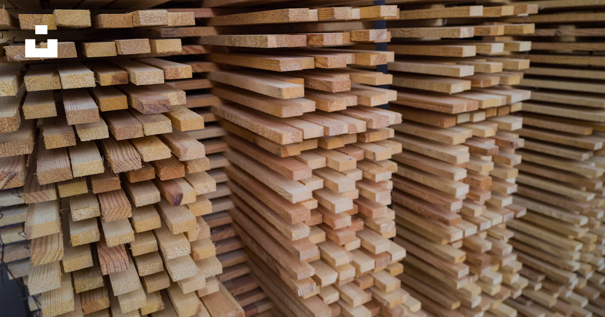 Stack Of Planks A stack of wooden planks stacked on top of each other photo – Free Wood ...