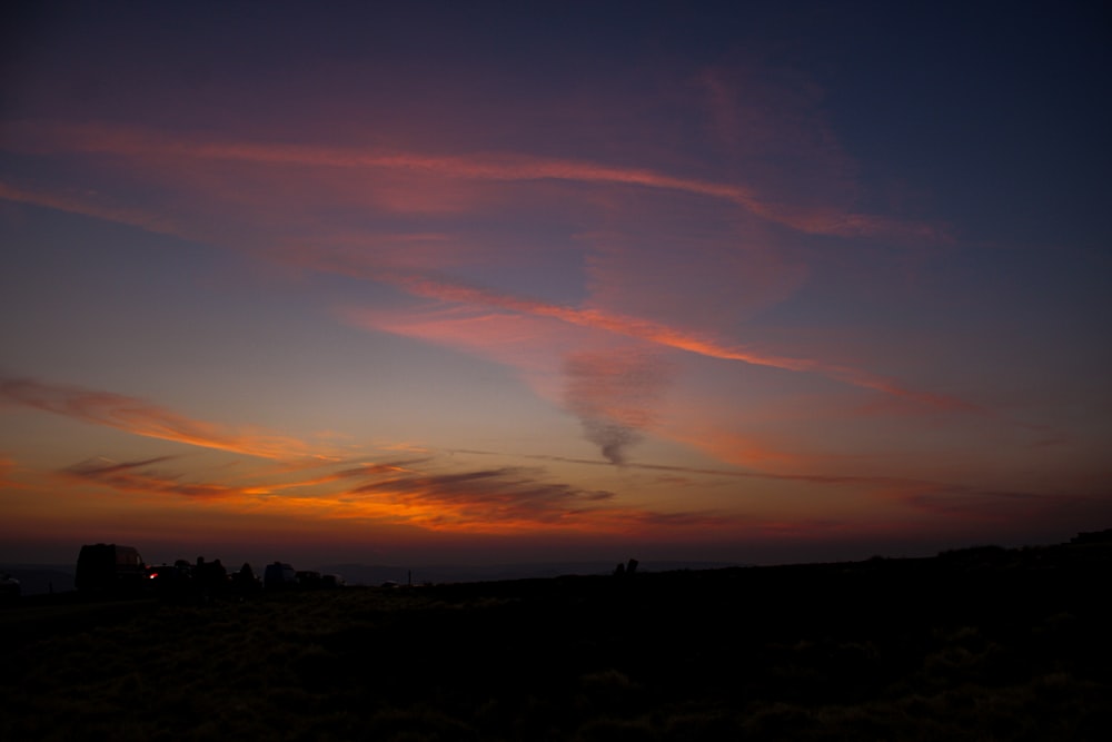 a sunset with clouds in the sky