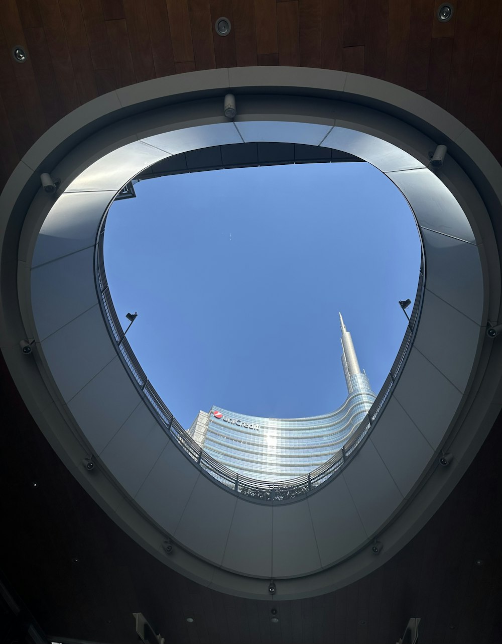 a view of a building through a circular window