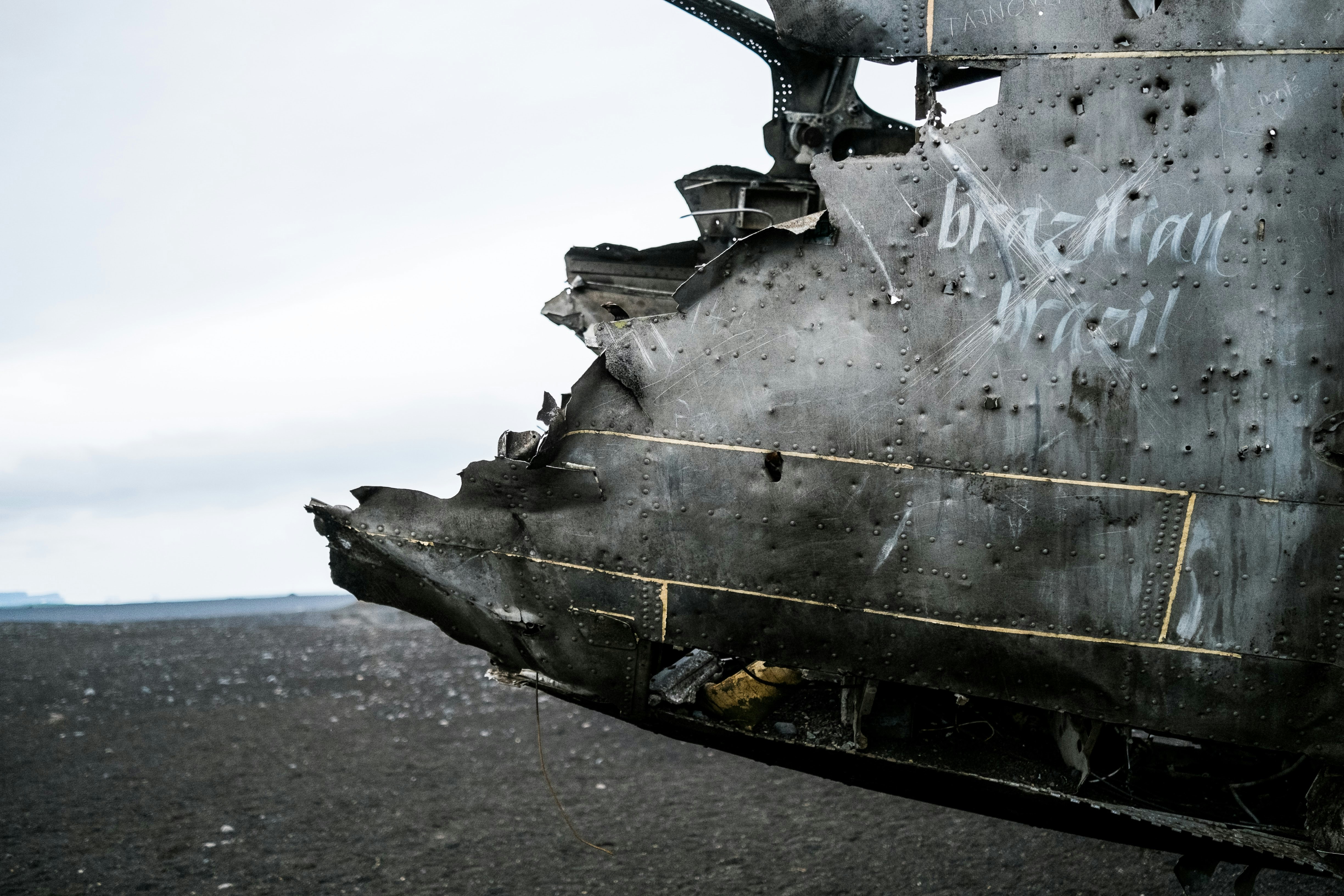 a close up of the side of a military helicopter (Photo by John Wayne Hill on Unsplash)
