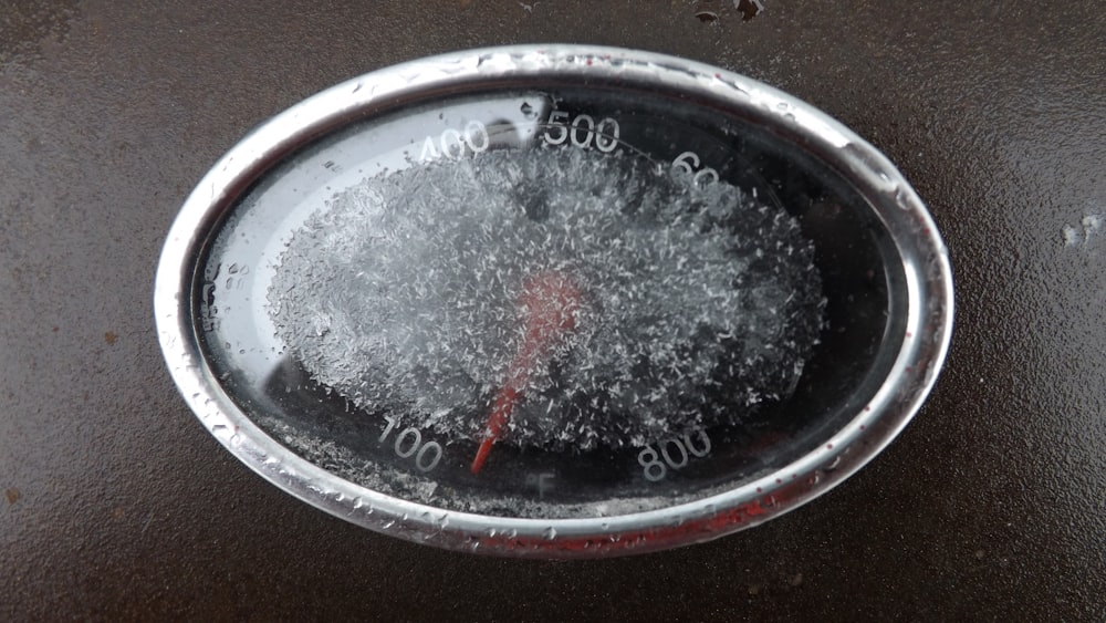 a close up of a thermometer on a table