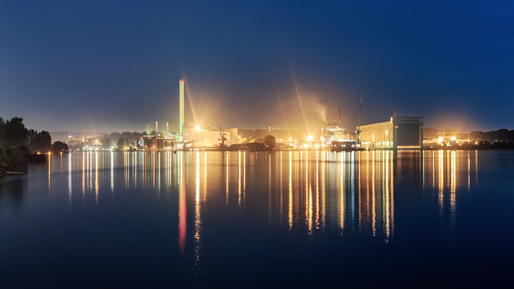 a large body of water with a city in the background