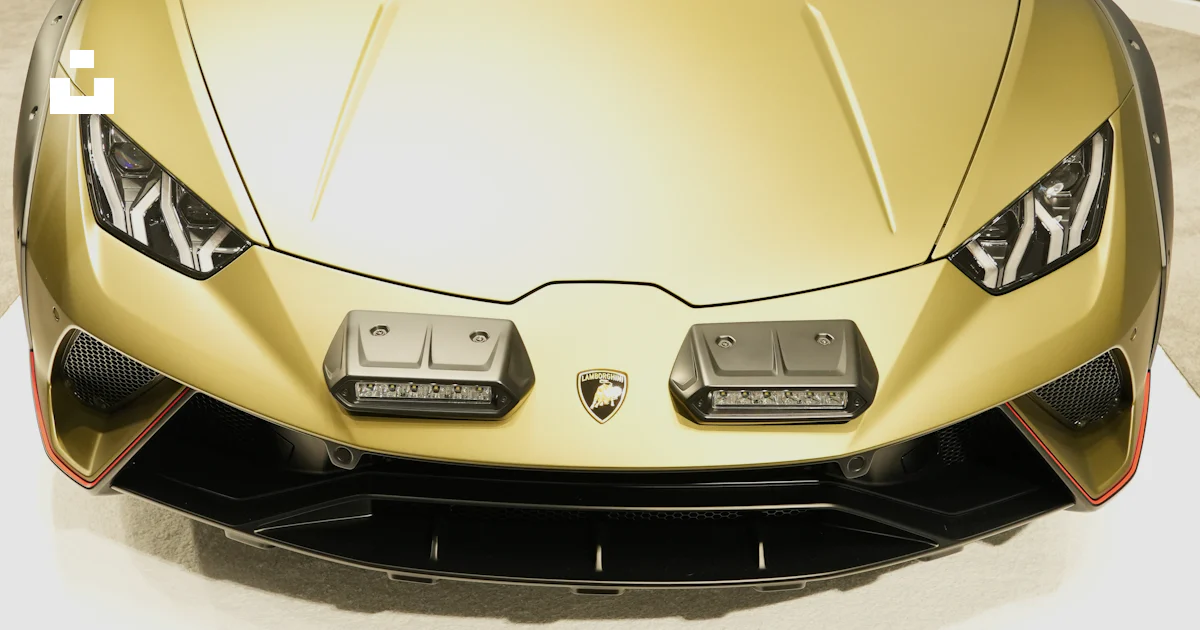 Jewish Racing Gold A gold colored sports car on display at a car show photo – Free Car ...