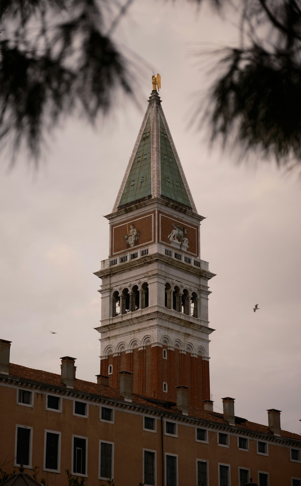 a tall tower with a clock on the top of it