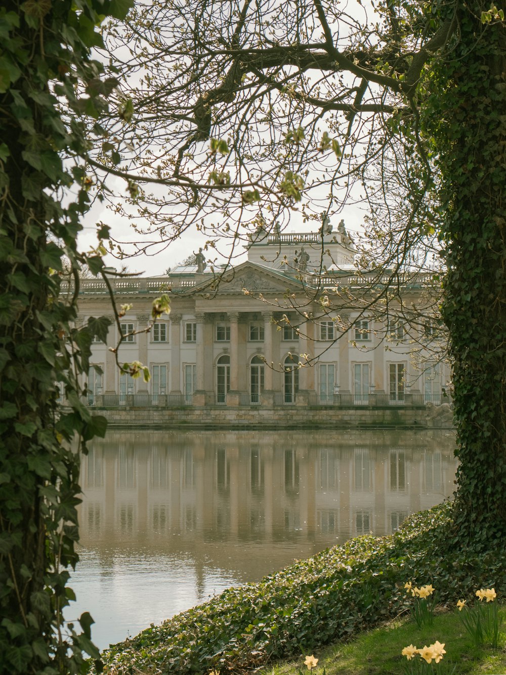 a large building sitting next to a body of water