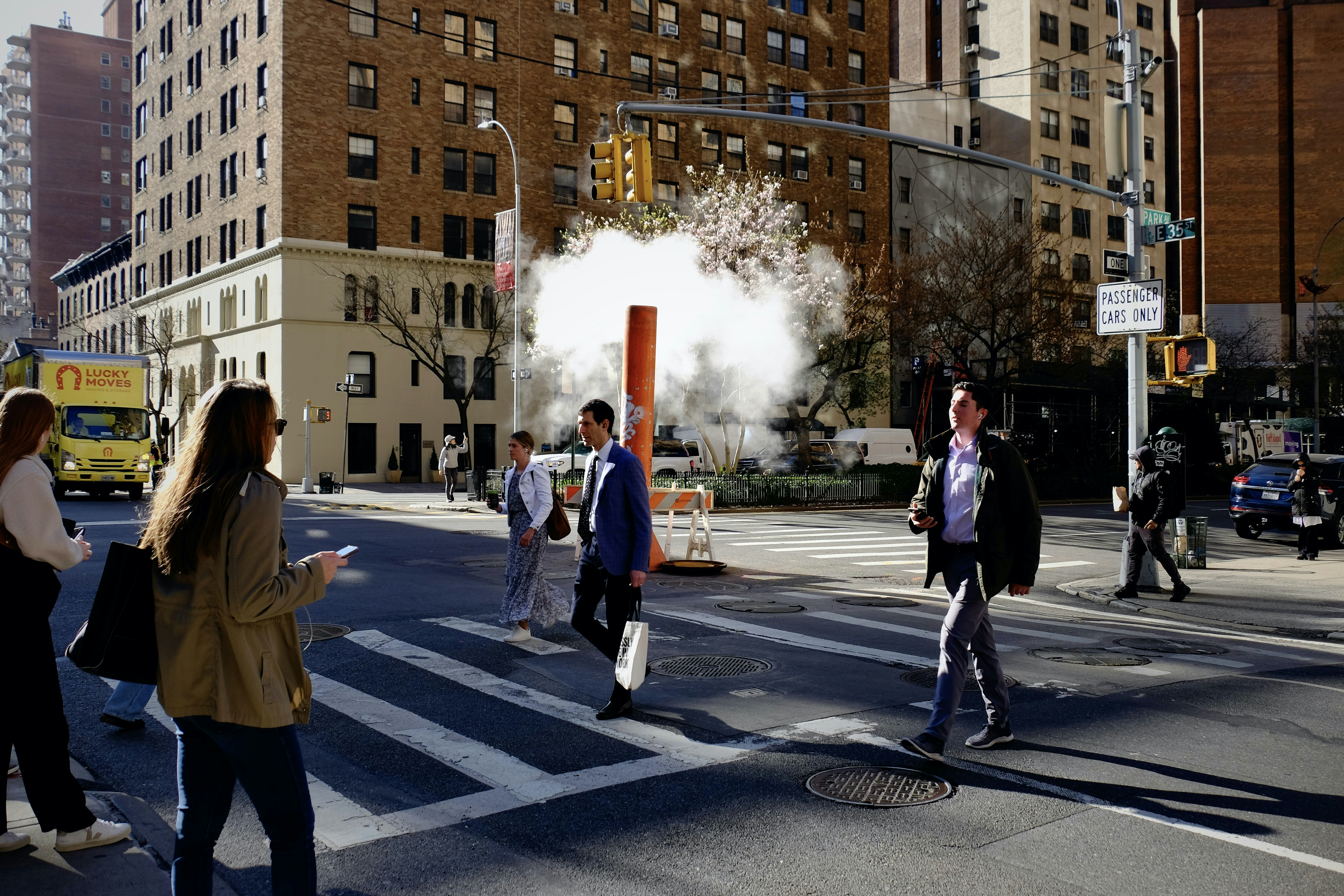 A group of people walking across a street photo – Free New york Image ...