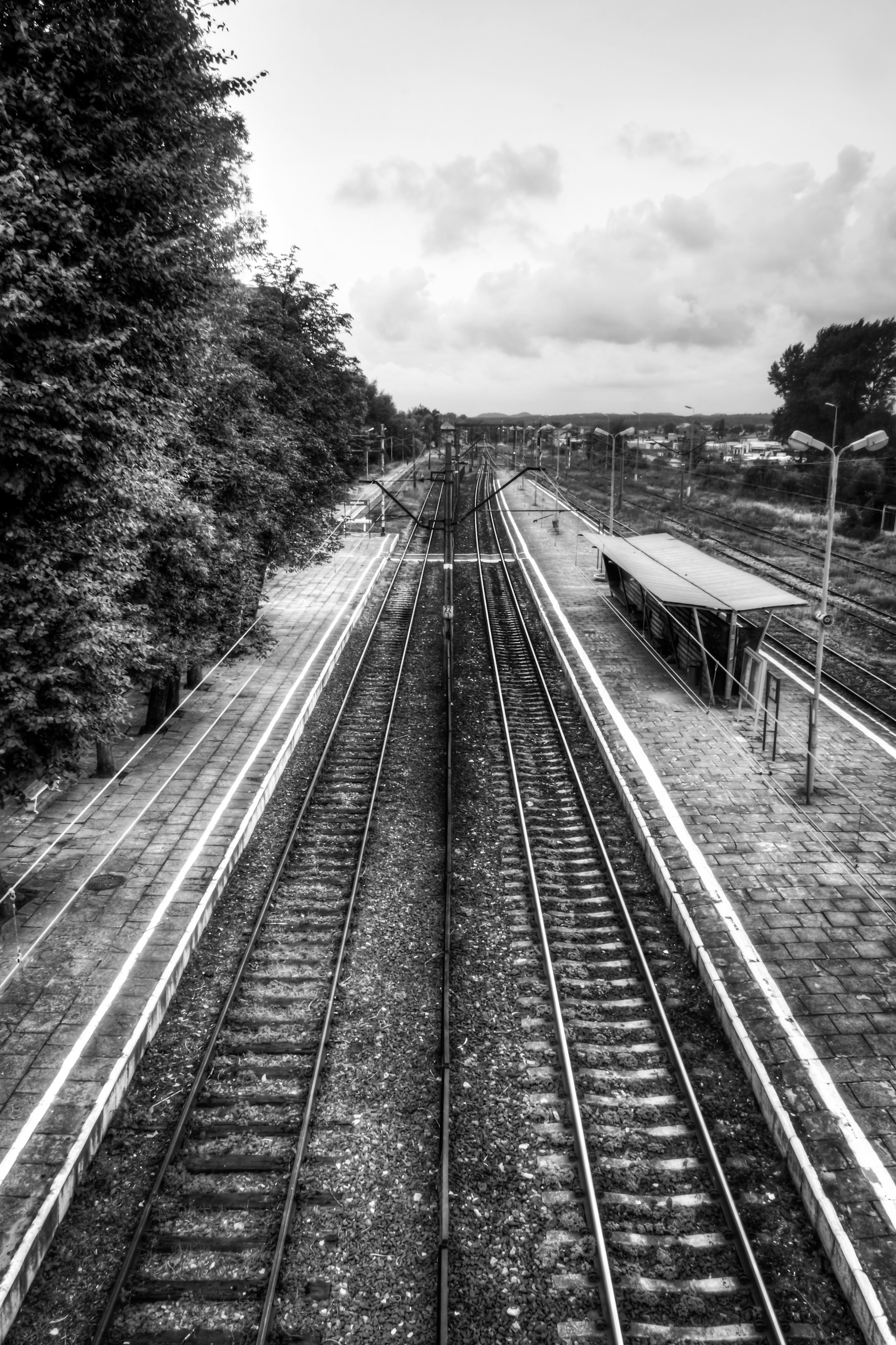 a black and white photo of a train track