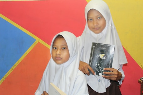 Students in traditional Islamic attire studying classical yellow books (kitab kuning) in a cozy library.
