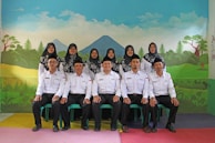 A group photo of Dr. Al Bab Farfad with volunteers from the Taqaddum party.