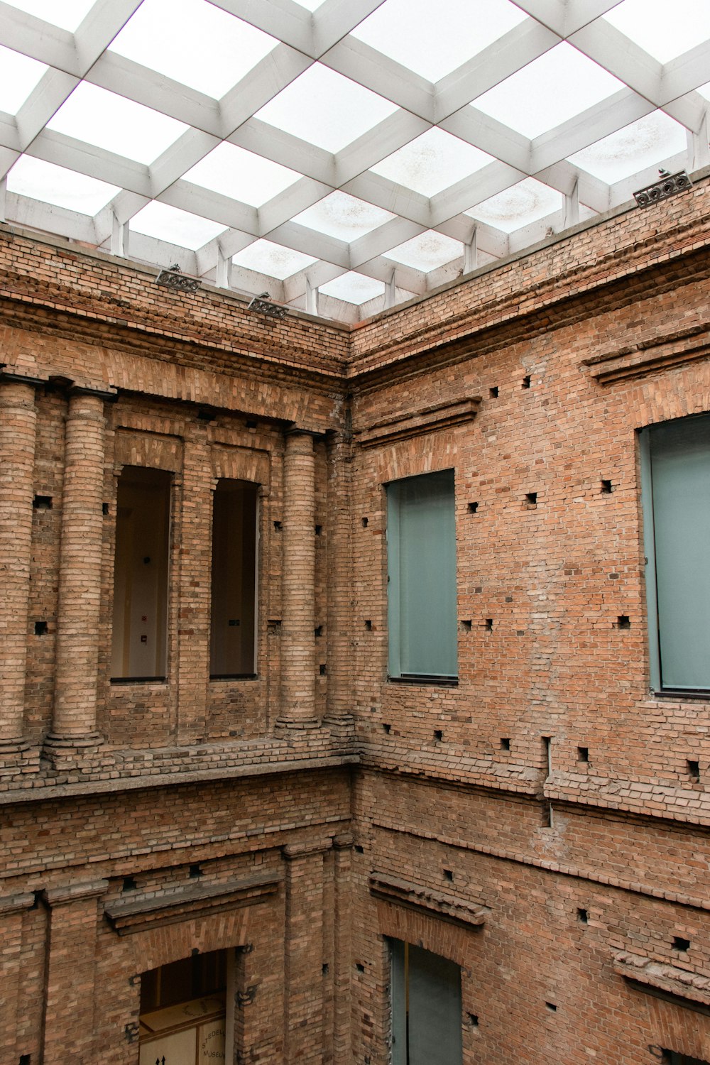 a brick building with holes in the wall