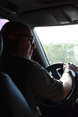 A driver attentively observing road conditions to avoid potential hazards