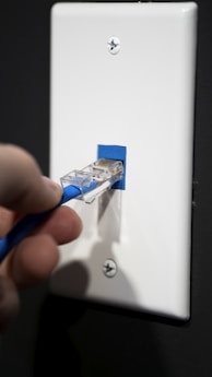 Technician installing internet cable at a customer's home