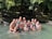 A group of women smiling together on a riverboat in the Amazon rainforest.
