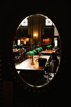 A cozy quiet zone with individual desks, soft lighting, and students immersed in their work