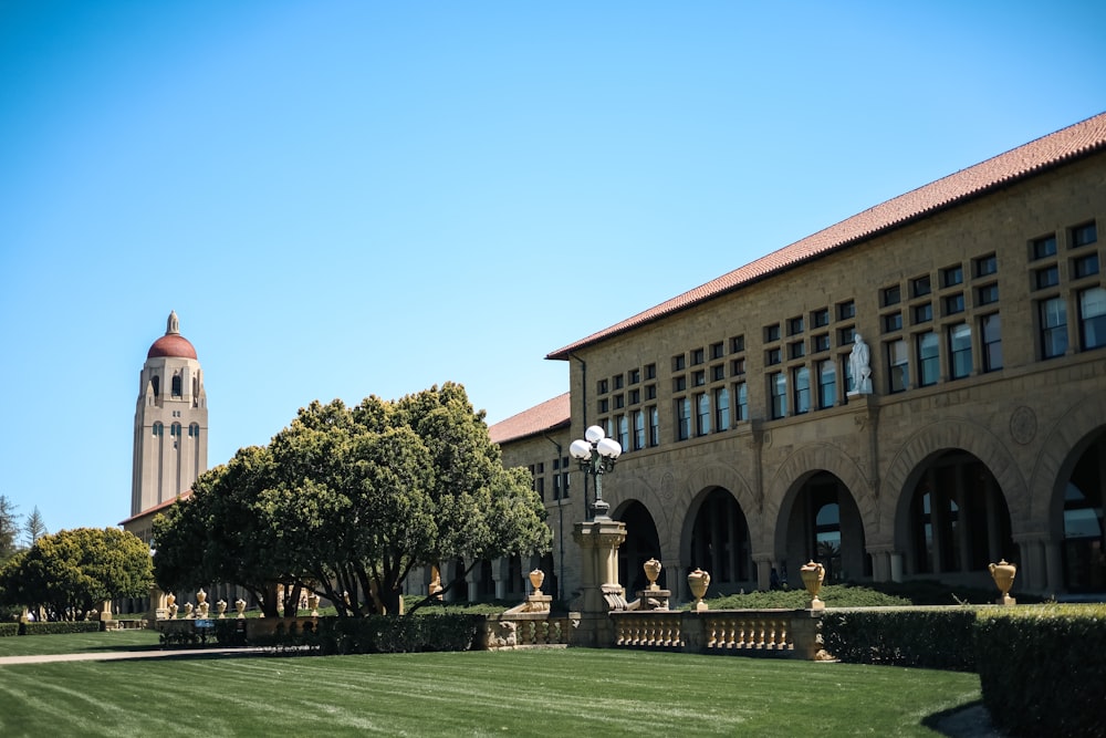 a large building with a clock tower in the background