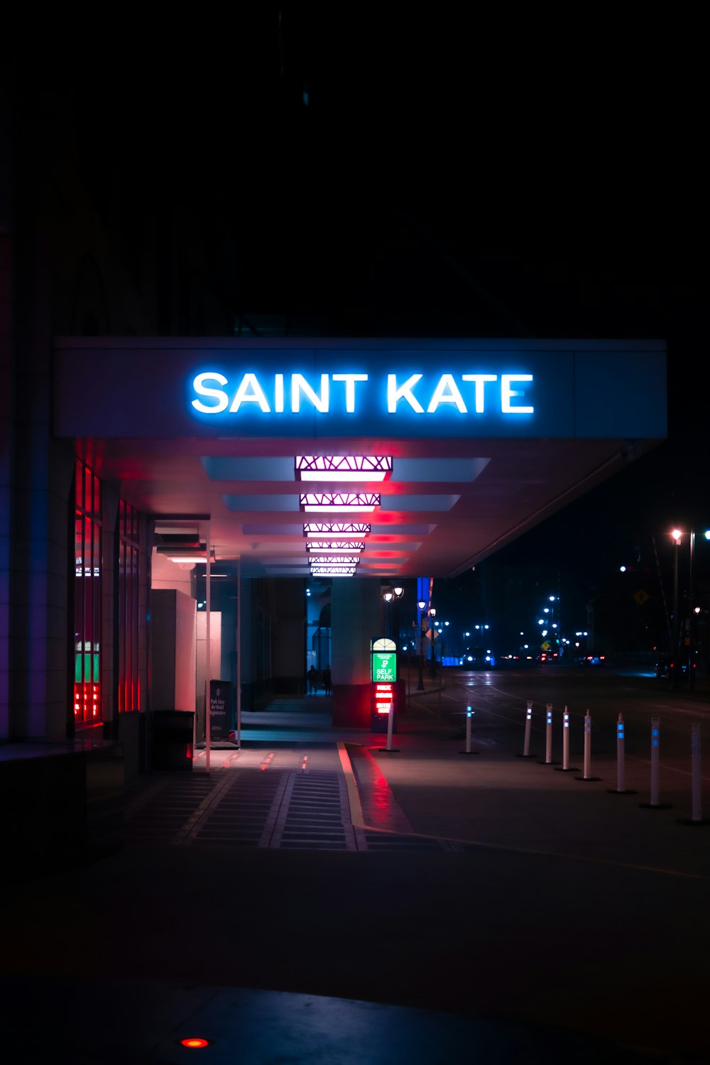 a lit up entrance to a building at night