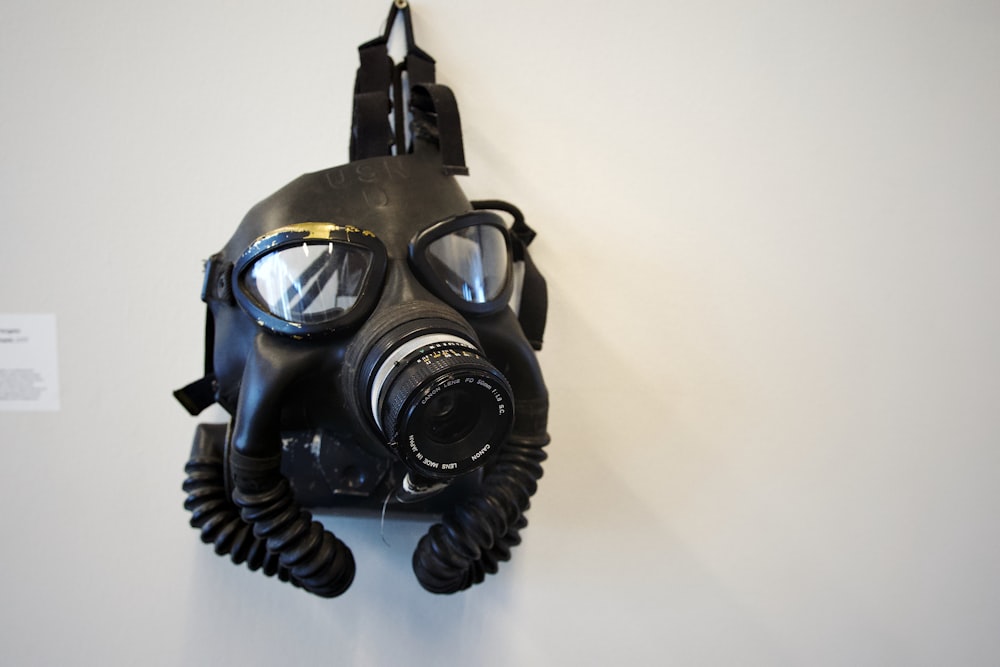 a gas mask hanging on a wall