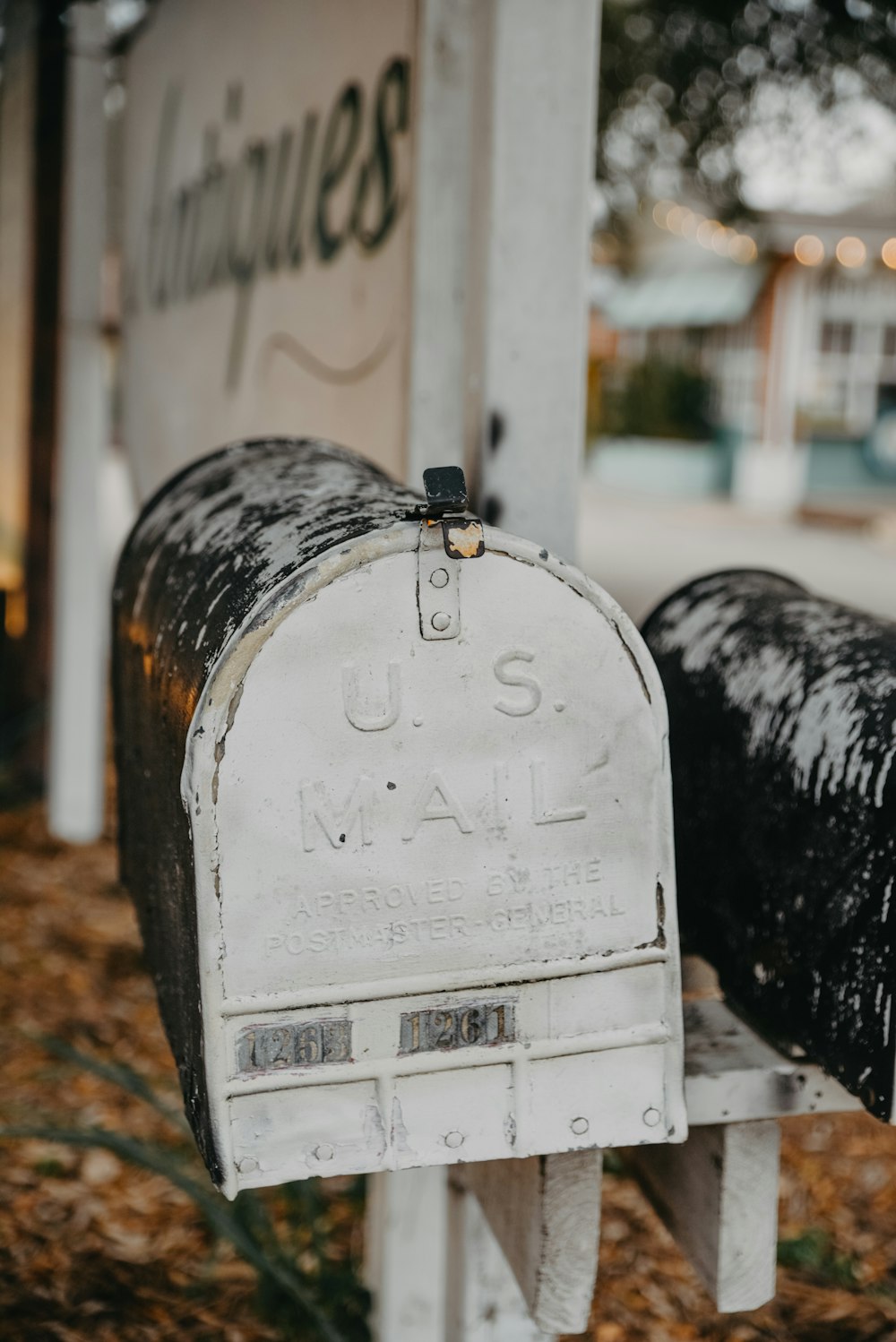 two mailboxes that are sitting in the grass