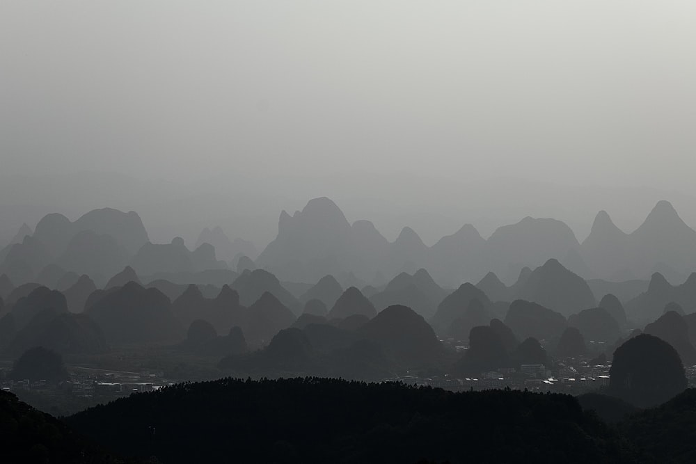 a view of a mountain range covered in fog