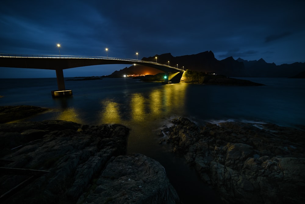 a bridge over a body of water at night