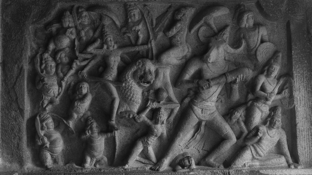a stone relief of a battle scene
