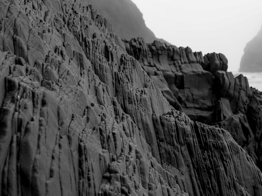 a black and white photo of a rocky beach