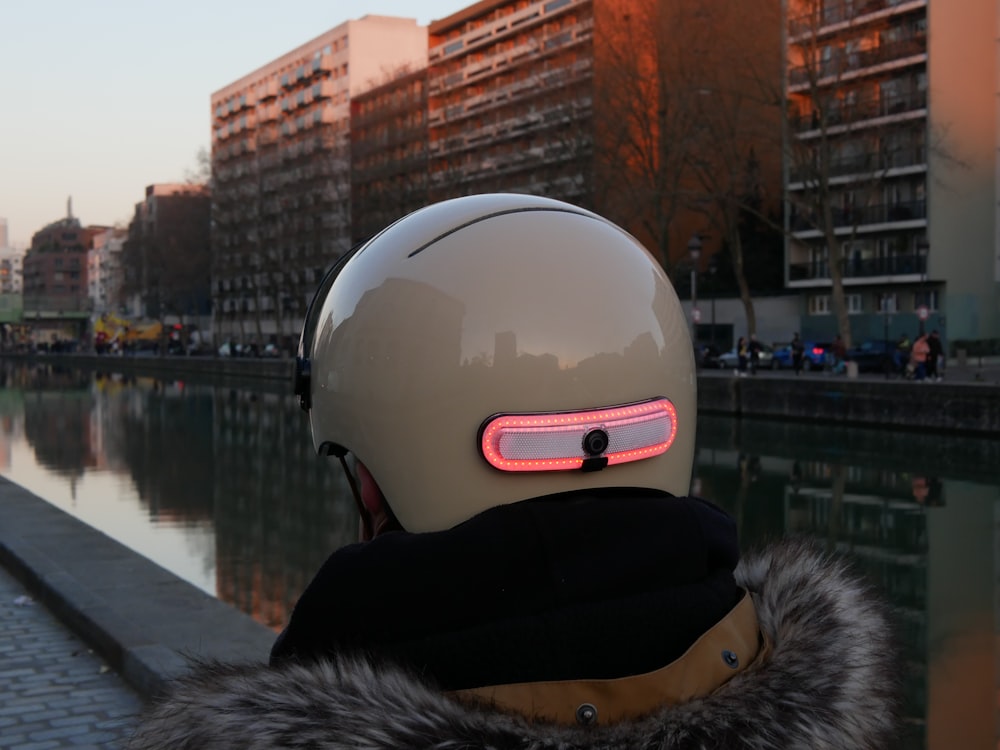a person wearing a helmet with a red light on it