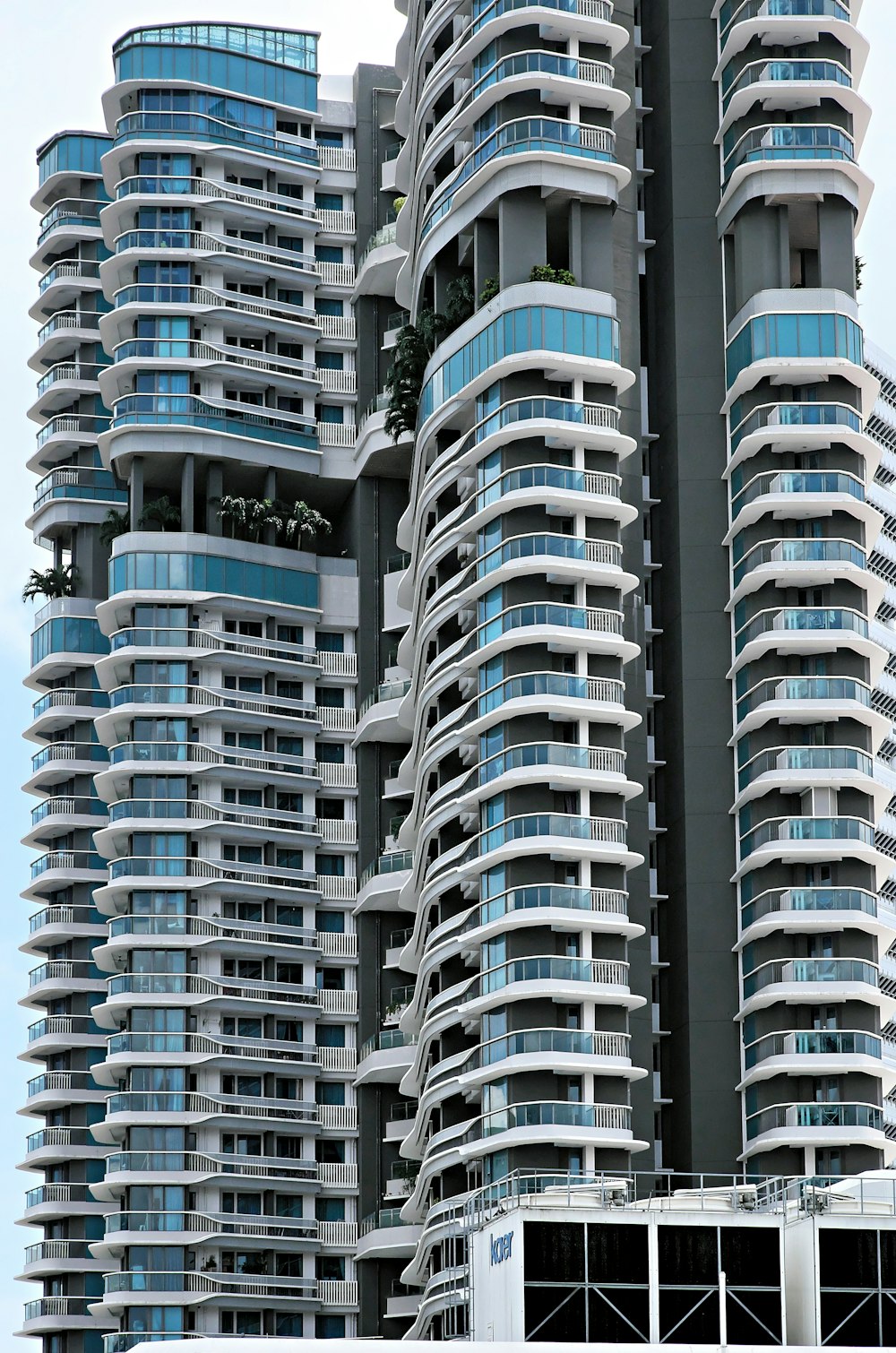 a very tall building with balconies on top of it