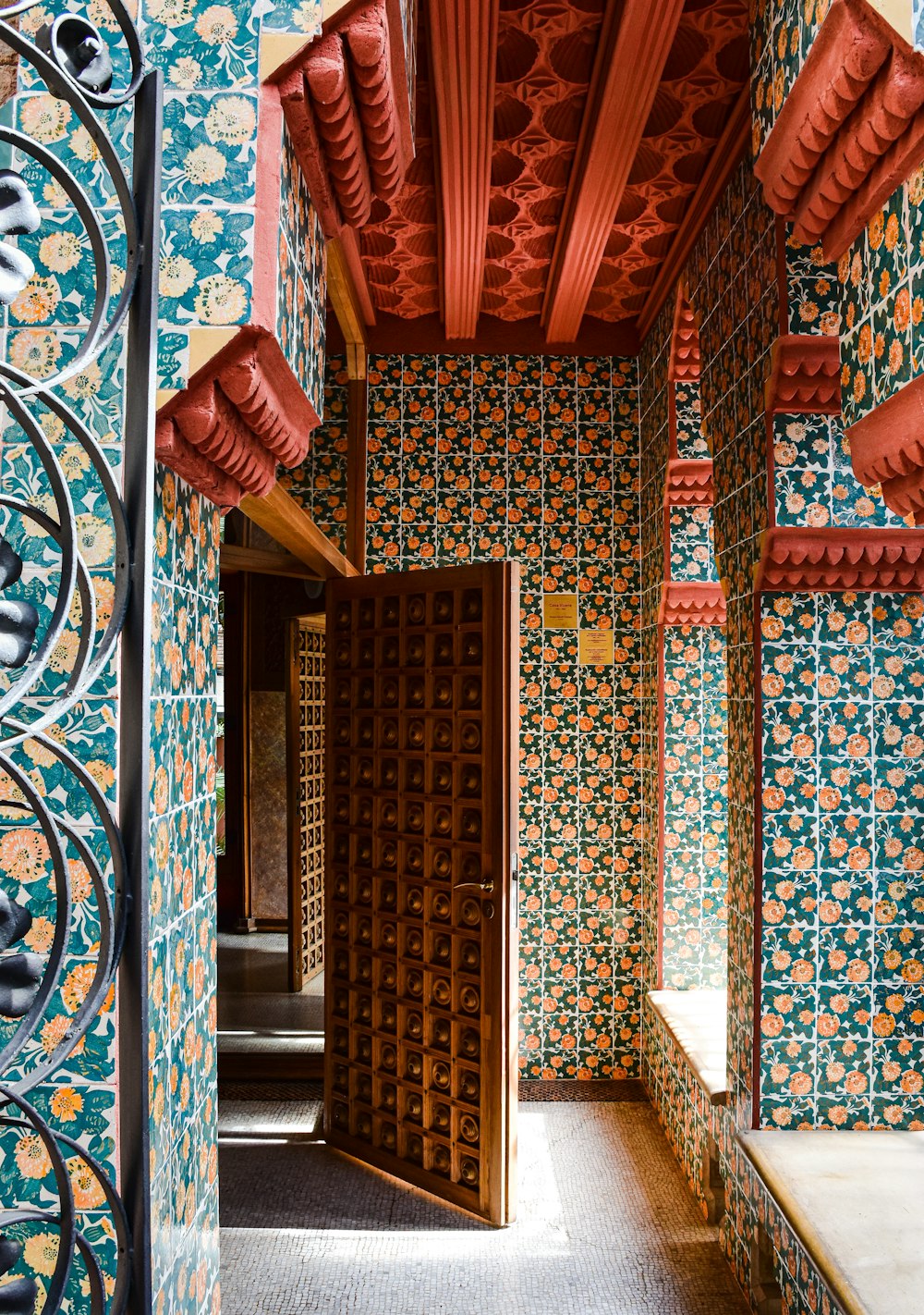 a hallway in a building with colorful wallpaper