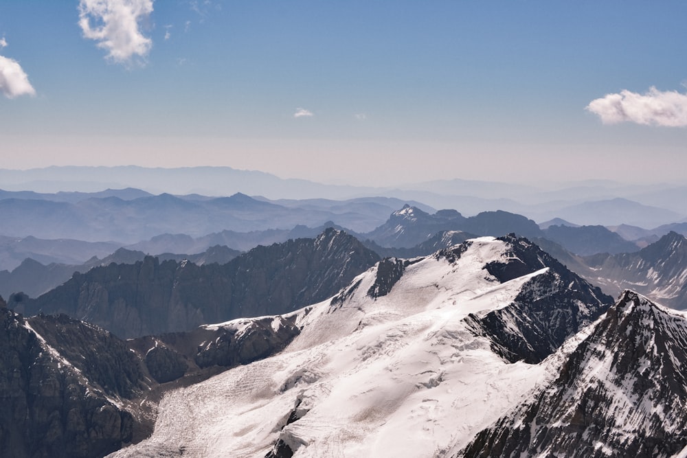 a view of a mountain range from the top of a mountain