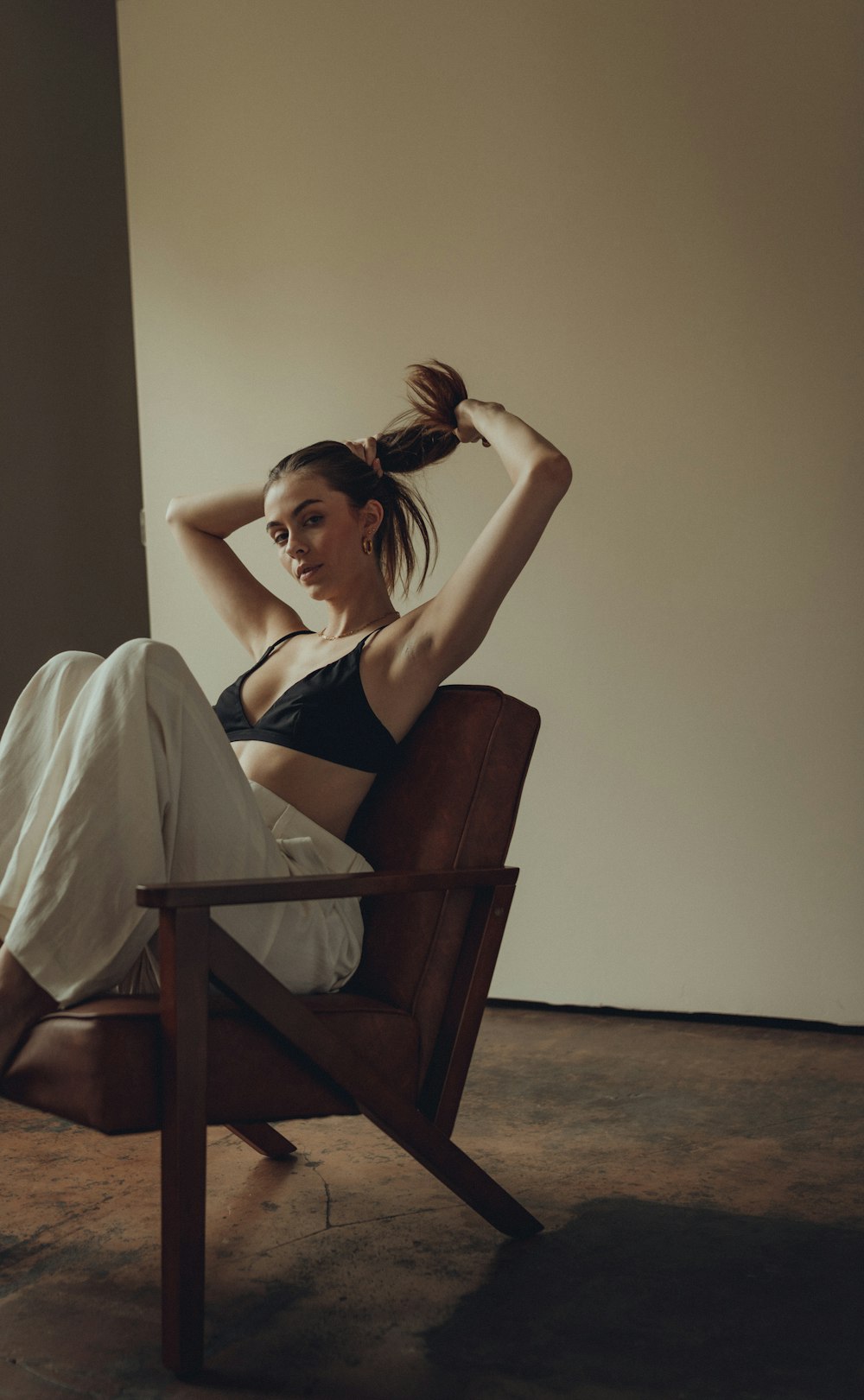 a woman sitting in a chair in a room