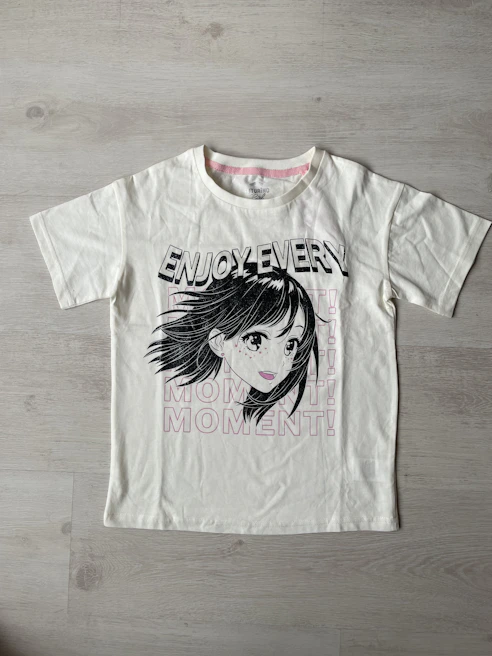 A happy customer proudly wearing a personalized t-shirt with a unique graphic