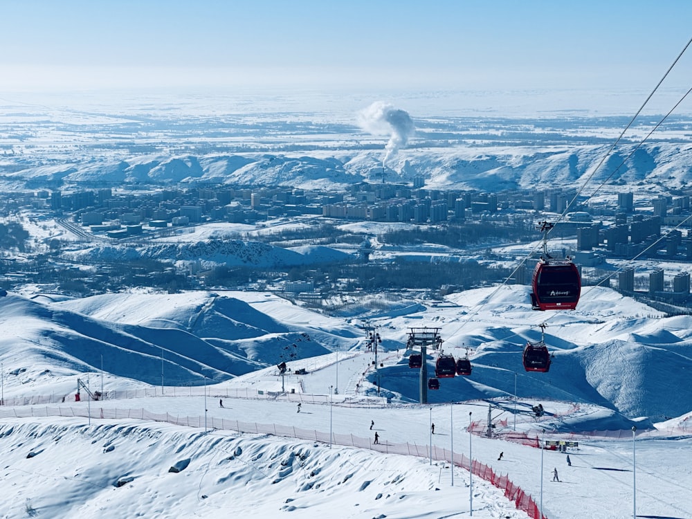 a ski lift going up a snowy mountain