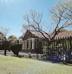 Photo of a vacant residential house in Winchester fully secured with fencing and alarms.