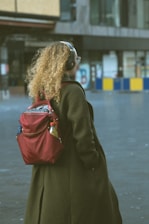 A person walking with headphones, surrounded by floating video frames and map markers.