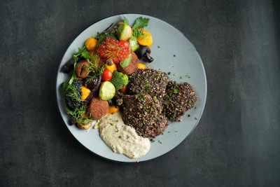 An elegant plated anniversary dinner with fresh herbs and seasonal vegetables.