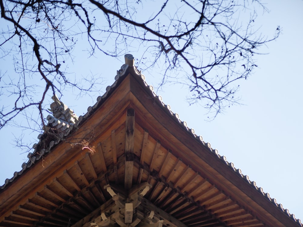 a tall wooden building with a clock on the top of it