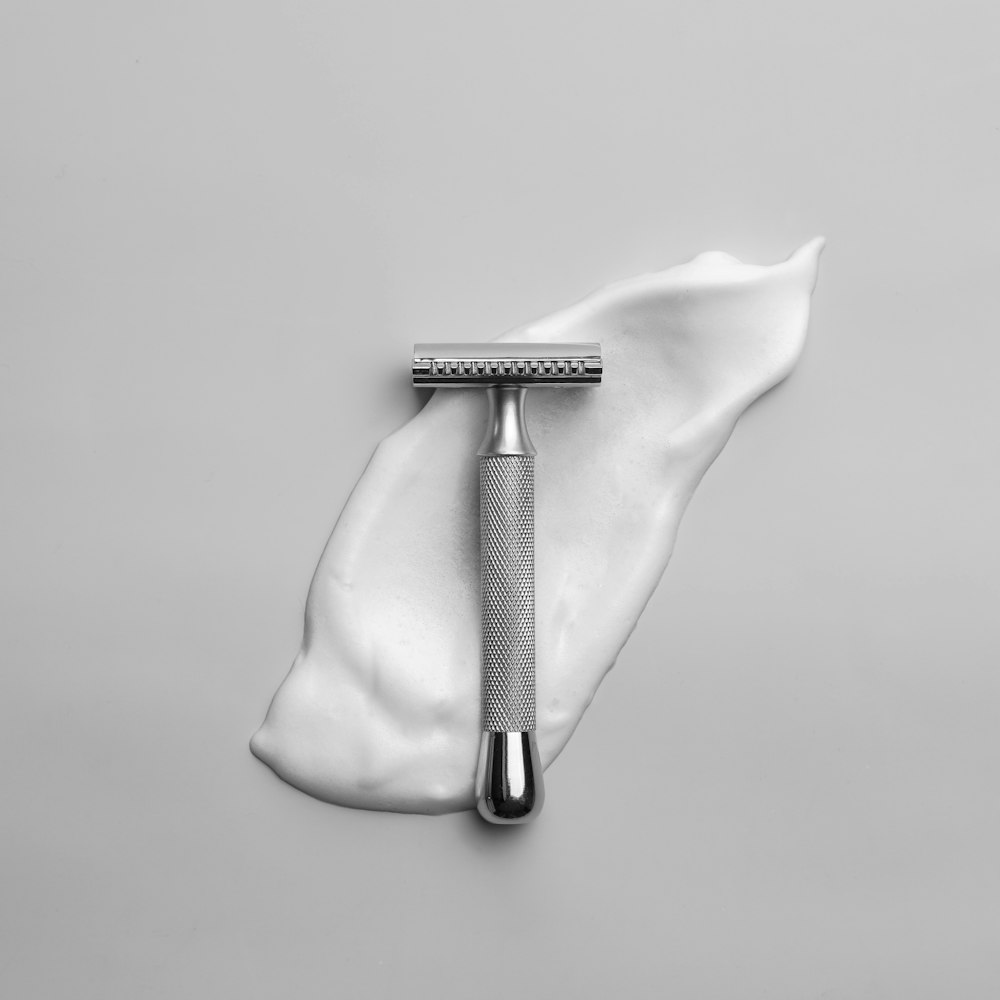 a toothbrush on top of a white cloth