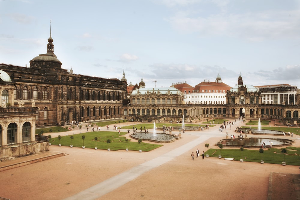 a large building with a fountain in front of it