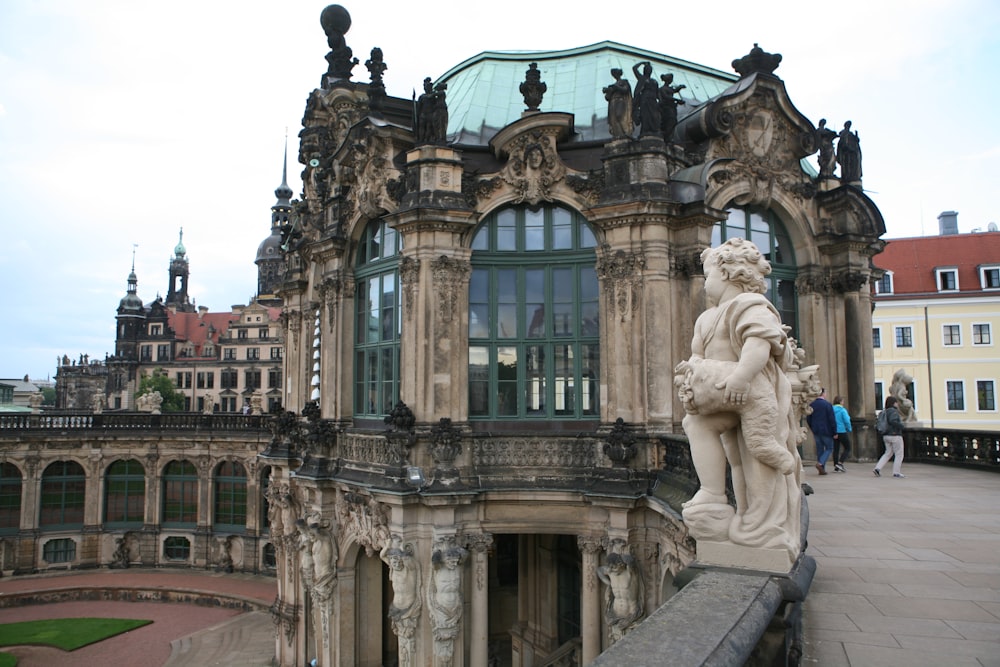 a large building with a statue on top of it