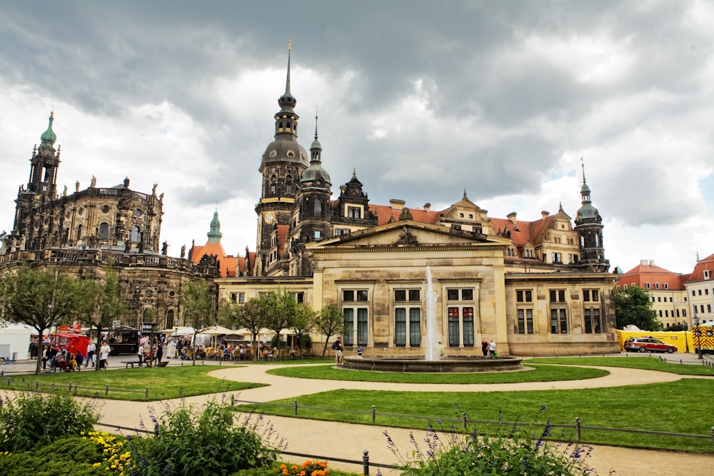 a large building with a fountain in front of it