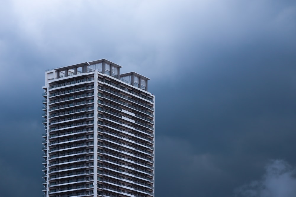 a tall building with a sky background